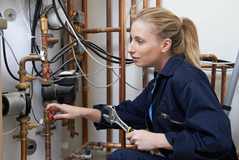 Female Plumber Working